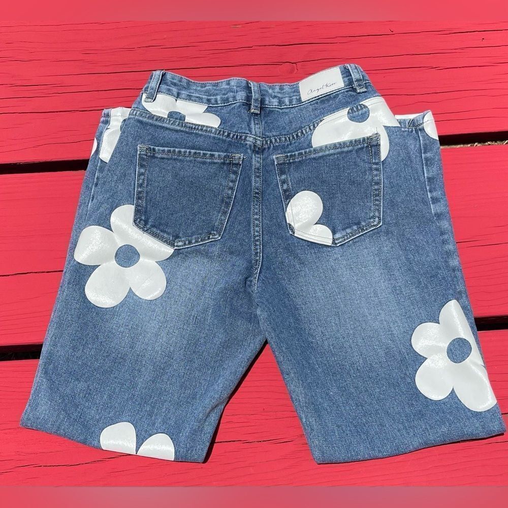 EUC Size 0/24 Angel Kiss denim with white floral accent.